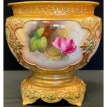 A Royal Worcester jardiniere, moulded in relief with four panels each painted with roses, on a