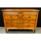 Brigitte Forestier for John Lewis - a cherrywood commode chest, of four drawers, 69cm high, 136cm