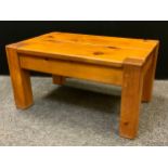 A contemporary pine plank top coffee table, square block legs, 47cm high, 90cm long, 58cm wide