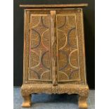An unusual Eastern style side cabinet, applied with wirework scrolls, 23cm high, 36cm wide