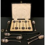 A set of six silver and enamelled coffee spoons, cased; a six silver Onslow pattern tea spoons and