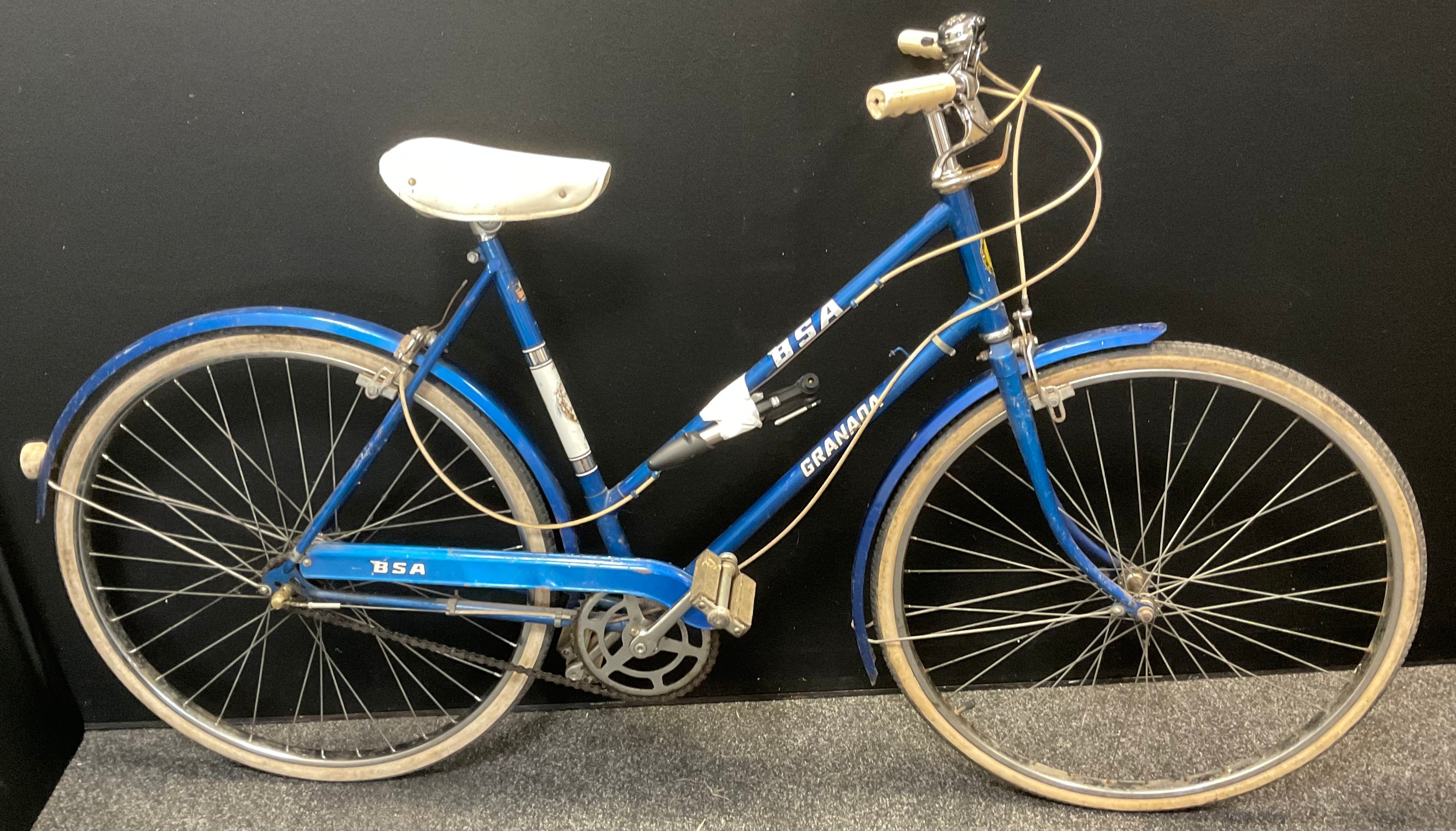 A BSA Granada lady’s bicycle, blue frame, three speed gears, 23 inch wheels, white wall tyres