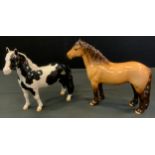 A Beswick model Pinto pony, piebald, No 1373; another 1644 Highland Pony, Dunn, both gloss (2)