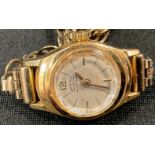 A lady's 18ct White Star Anti-Magnetic gold wristwatch, 9ct gold strap, 11.8g