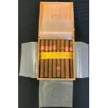 A box of Flor De Tabocos , Partagas Habana cigars, 8-9-8.