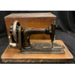 A sewing machine, cased