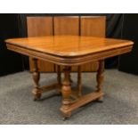 A 19th century French extending mahogany dining table