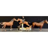 A Beswick Huntswoman, jumping side saddle, designed by Arthur Gredington, model no. 982, printed