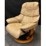 A Stressless Reno Classic recliner armchair, in pale beige leather.