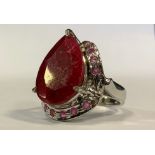 A large ruby cocktail ring, pear cut, 30ct, silver mount