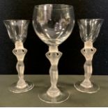 A pair of Art Deco Lalique style frosted and clear glasses, figural stems, another larger (3)