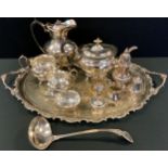 Silver Plate - a four piece boat shaped tea service; a two handled tray; a caster; ladle; jugs'; etc