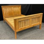 A pine double bed, the headboard measuring 120cm tall x 149.5cm wide (foot board 86cm tall), overall