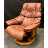 A Stressless Reno Classic recliner armchair, in tan leather.