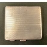 A silver cigarette case, engine turned, 4.5oz