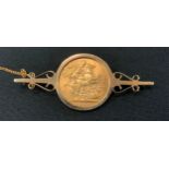 An Edward VII sovereign, 1904, mounted as a brooch, 9ct gold mounts, 11.7g gross