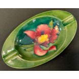 A Moorcroft oval Hibiscus pattern pin tray, 15.5cm long