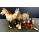 A Beswick Highland dun, Mackionneach , no. 1644, printed marks; a Sylvac bay foal, 1447; a bay shire