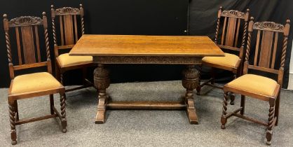 A mid 20th century oak refectory dining table and 4 chairs, rectangular top, carved frieze,