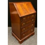 A 20th century reproduction mahogany bureau, 99cm tall x 53.5cm wide x 43.5cm deep.