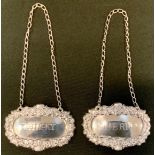A pair of silver decanter labels; whisky and sherry, Birmingham 1986