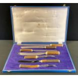 A Mappin & Webb Trustworthy stag horn handled seven piece carving set, stainless steel blades, cased