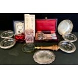 An R Carr silver easel ravel clock, modern, boxed; a set of four plated and glass coasters; scent