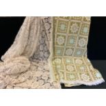 A woollen wheel and block design blanket, probably Welsh, in cream, green, turquoise and brown,