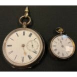 A George V silver open face pocket watch, key wind movement, London 1928; another smaller