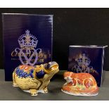 A Royal Crown Derby paperweight, Hippopotamus, silver stopper, printed mark, boxed; another Otter,