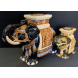An oriental ceramic Elephant garden seat, 41cm high, 52cm long; another smaller, 28cm high, 30cm