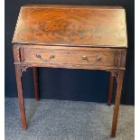 A 20th century mahogany bureau. fall front, fitted interior, tapering legs, 95cm high, 78cm wide,