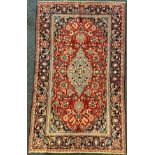A Najafabad / Najaf-Abad rug / carpet, the central medallion knotted in pale blue, within an