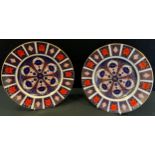 A pair of Royal Crown Derby 1128 Imari dinner plates, 26.5cm diameter, both firsts, printed marks (