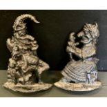 A pair of cast aluminium door stops, Punch & Judy, 29cm high & 26cm high