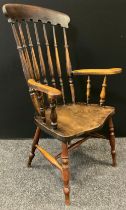 An early 20th century Farmhouse spindle-back elbow chair, shaped seat, H stretcher, 112cm tall.