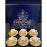 A set of six Royal Crown Derby Aves Gold coffee cups and saucers, printed marks, boxed