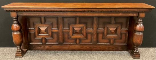 A Jacobean revival panelled oak over-mantle, turned baluster supports, 168cm wide at top (154cm wide