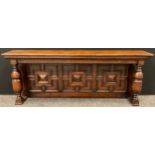 A Jacobean revival panelled oak over-mantle, turned baluster supports, 168cm wide at top (154cm wide