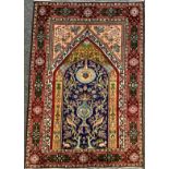 An Iranian Qom or Ghom rug / carpet, 145cm x 98cm.
