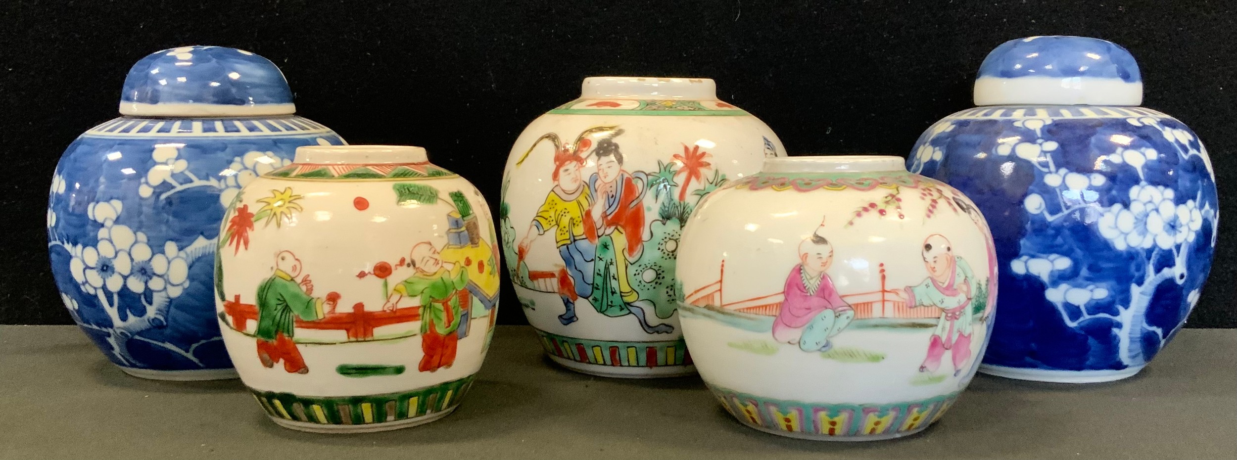 A pair of Chinese blue and white Ginger jars, with covers, flowering prunus decoration, concentric