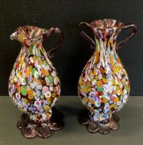 A millefiori glass twin handle vase, splayed foot, similar jug, 23.3cm high (2)