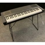 Musical instruments - A Yamaha YPP-35 electric piano on stand.