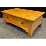 A contemporary oak coffee table, single large drawer to base, 43cm tall x 106cm x 65cm.