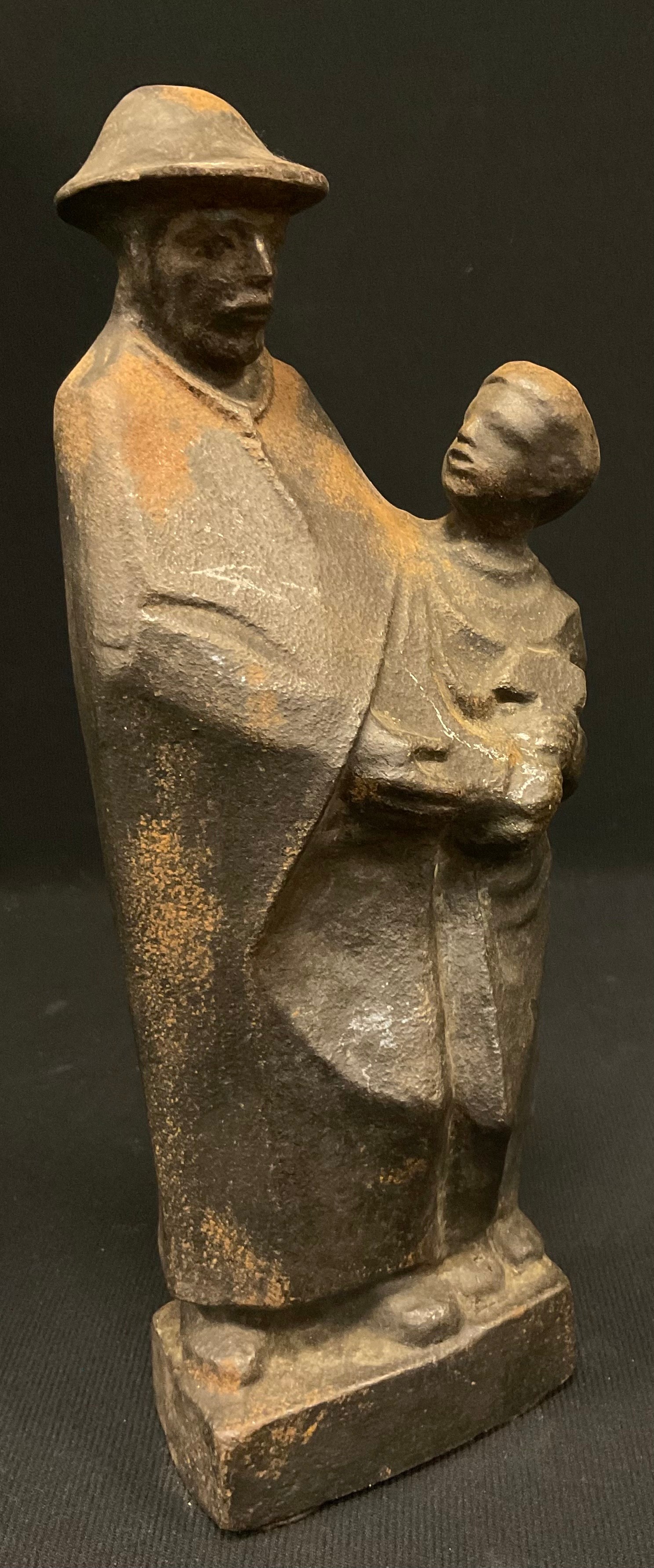 M Kuh**, a patinated iron sculpture, Figure and Boy with a hammer, signed and inscribed in the - Image 2 of 5