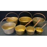 A large brass jam pan, steel handle, 38cm diam; others, various; a set of three graduated brass