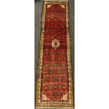 A North-west Persian Hamadan rug / runner carpet, 266cm x 73cm.