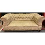 A Victorian Chesterfield sofa, button back, later upholstered in cream and pale green floral fabric,