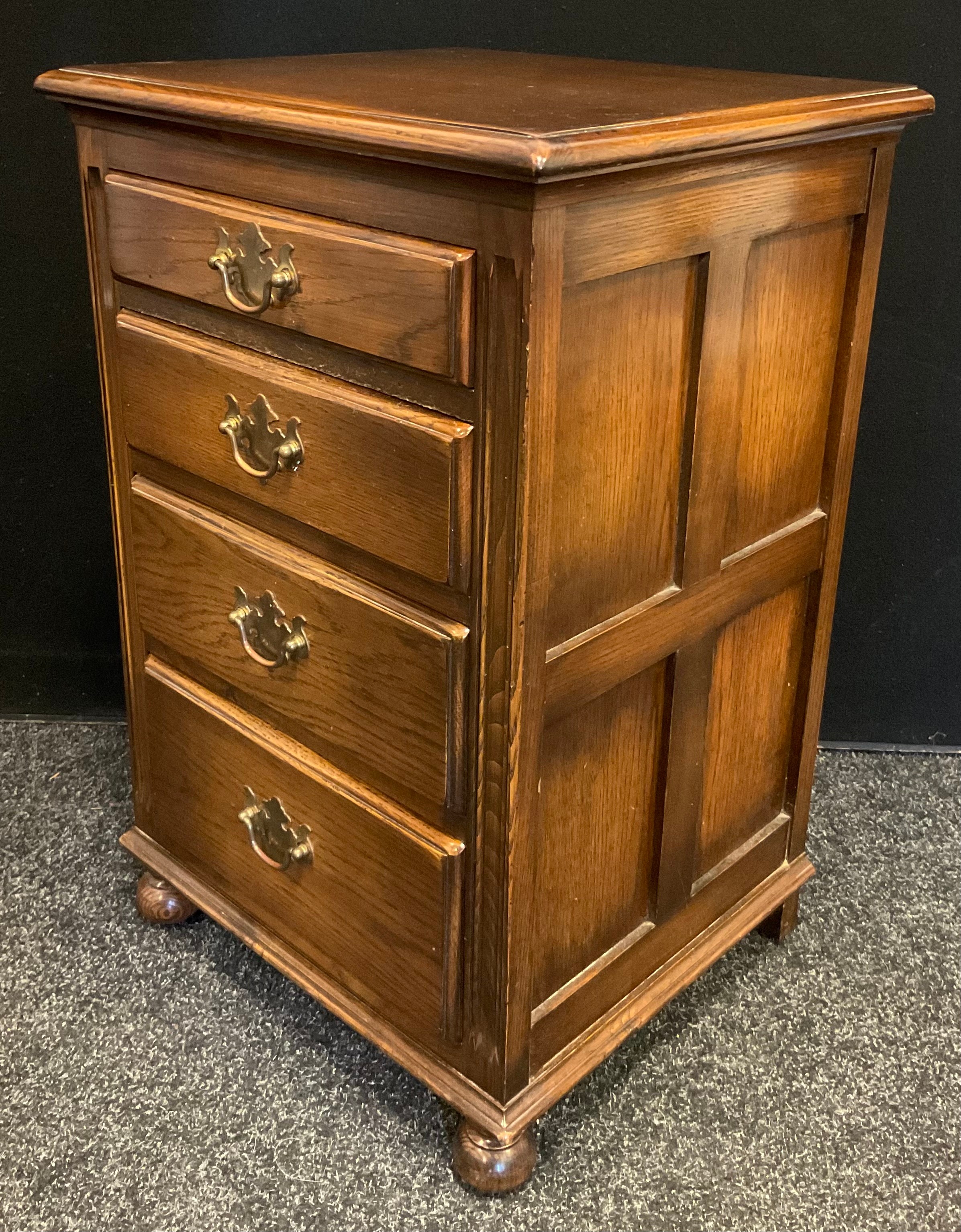 A small Bevan Funnell narrow oak chest, four graduated drawers, bun feet, 70cm tall x 45cm wide x