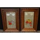 A pair of Edwardian etched and painted mirrors with grape and floral bouquet detail, carved oak